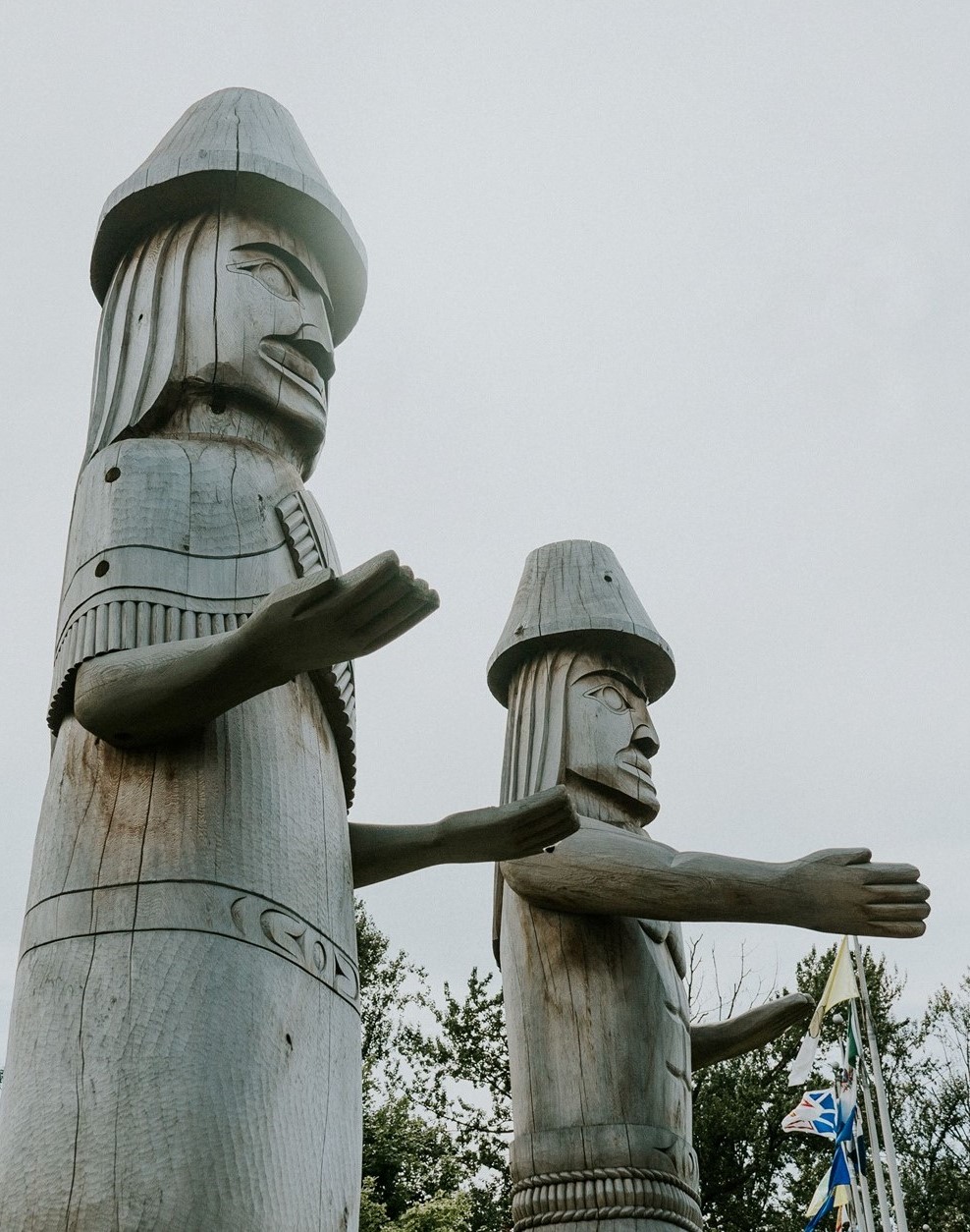 Artist Terry Horne's Stó:lō Welcome Figures that stand outside the Chilliwack Visitor Centre.