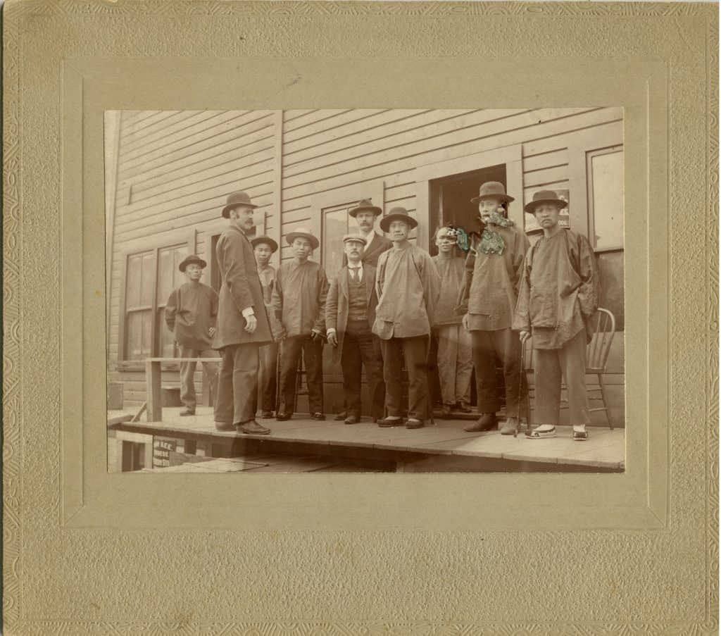 2282.0049: The Kee Chinese Store, July 1898. The names of the men standing outside are unknown.