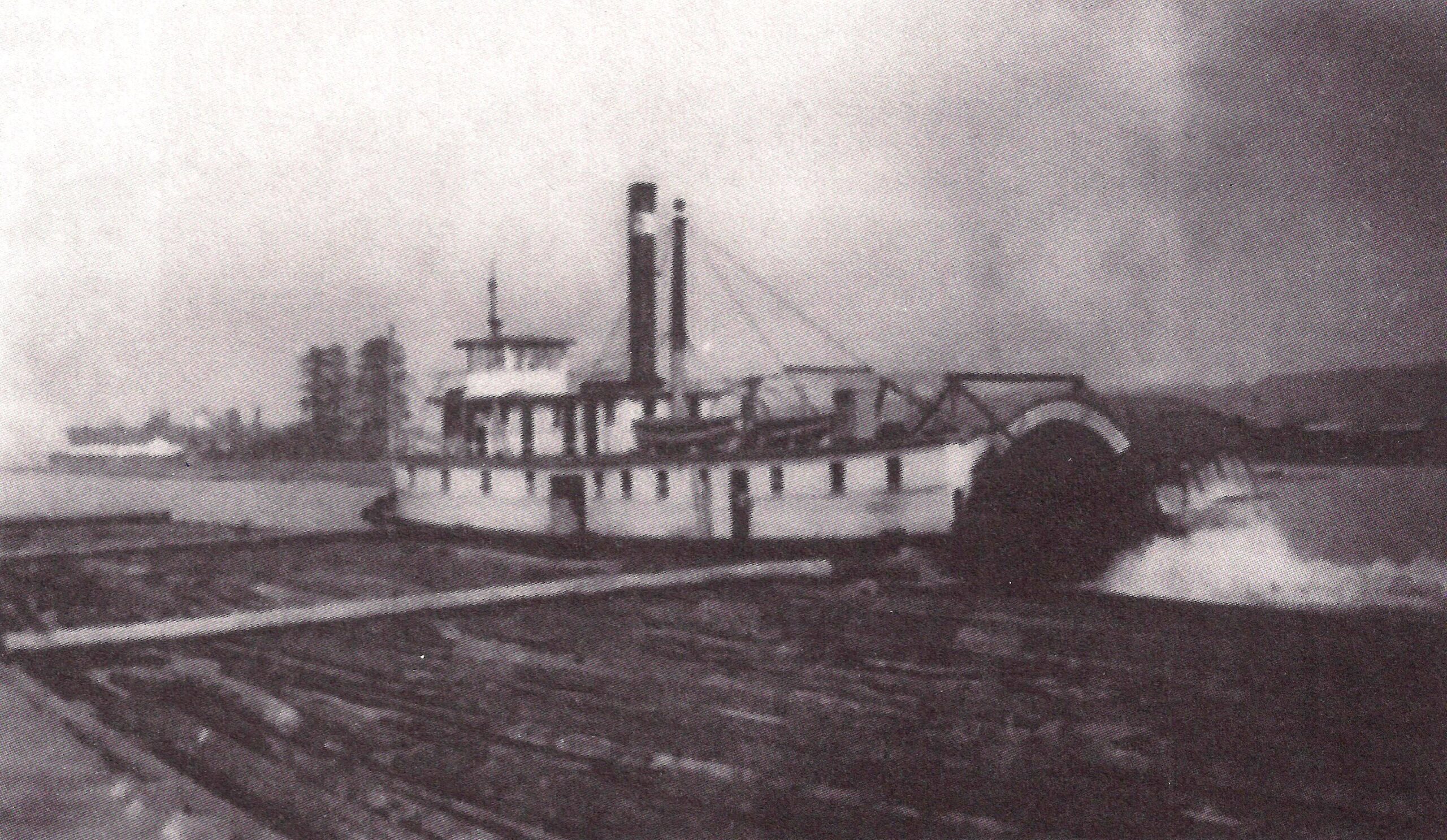Black and White photo of the J.D. McCormack working a log boom on the Fraser River in 1932