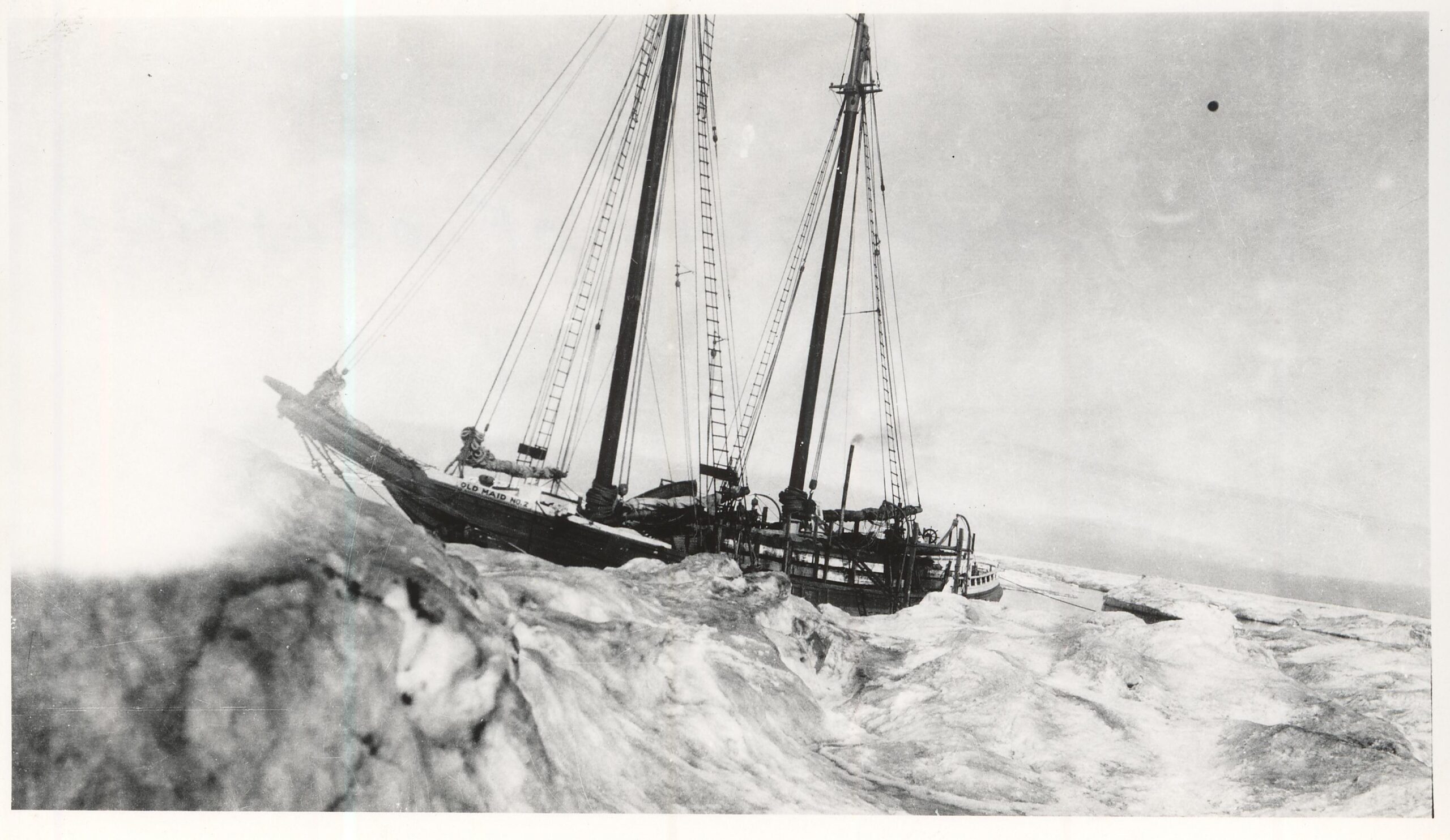 A black in white photo of Maid of Olreans trapped in Arctic ice.