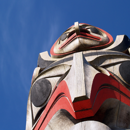 looking up at a totem pole
