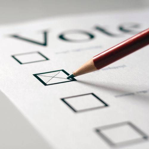 paper with vote at the top and a checkbox with pencil
