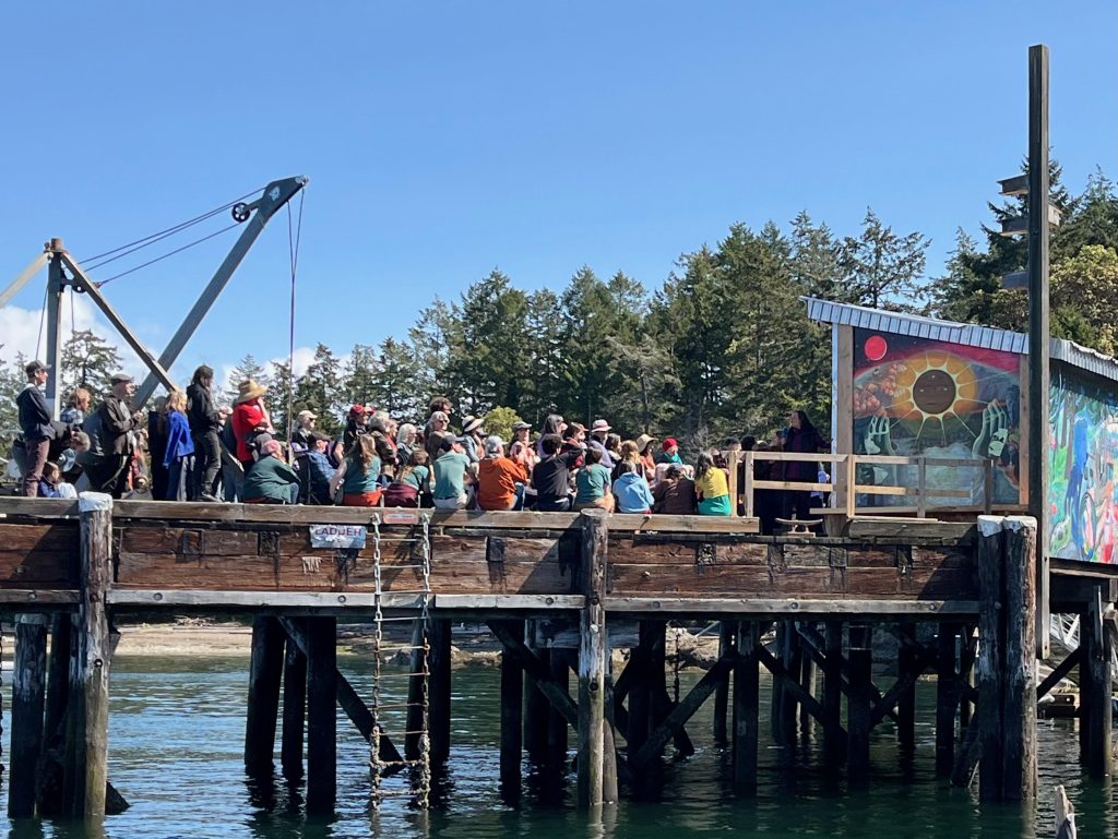 People standing on a dock.