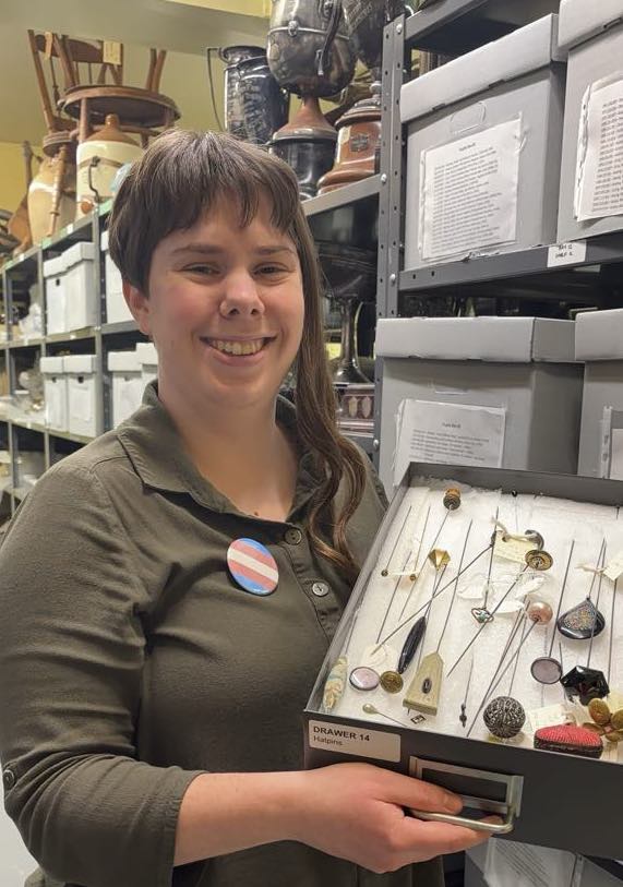 Person holding a museum display